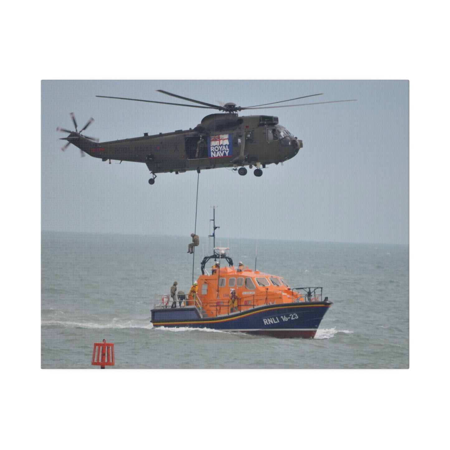 Sea King Helicopter Roping Down Crew Onto The RNLI Lifeboat Canvas