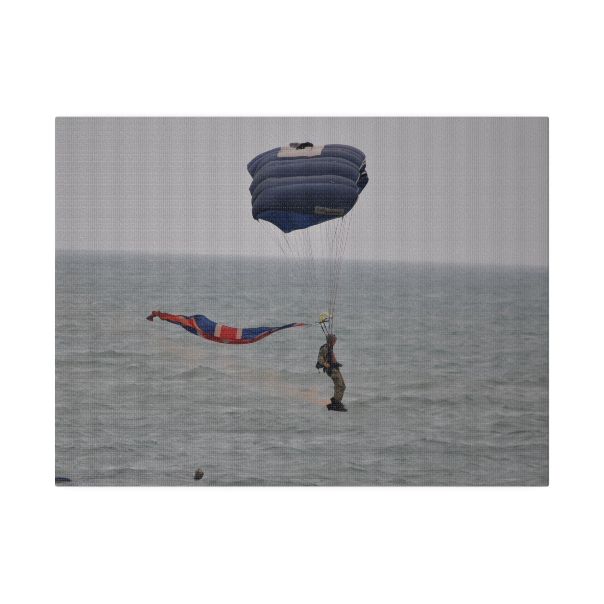 Parachuter With Flag And Smoke Just Above The Sea Canvas - The Trio Synergize Group