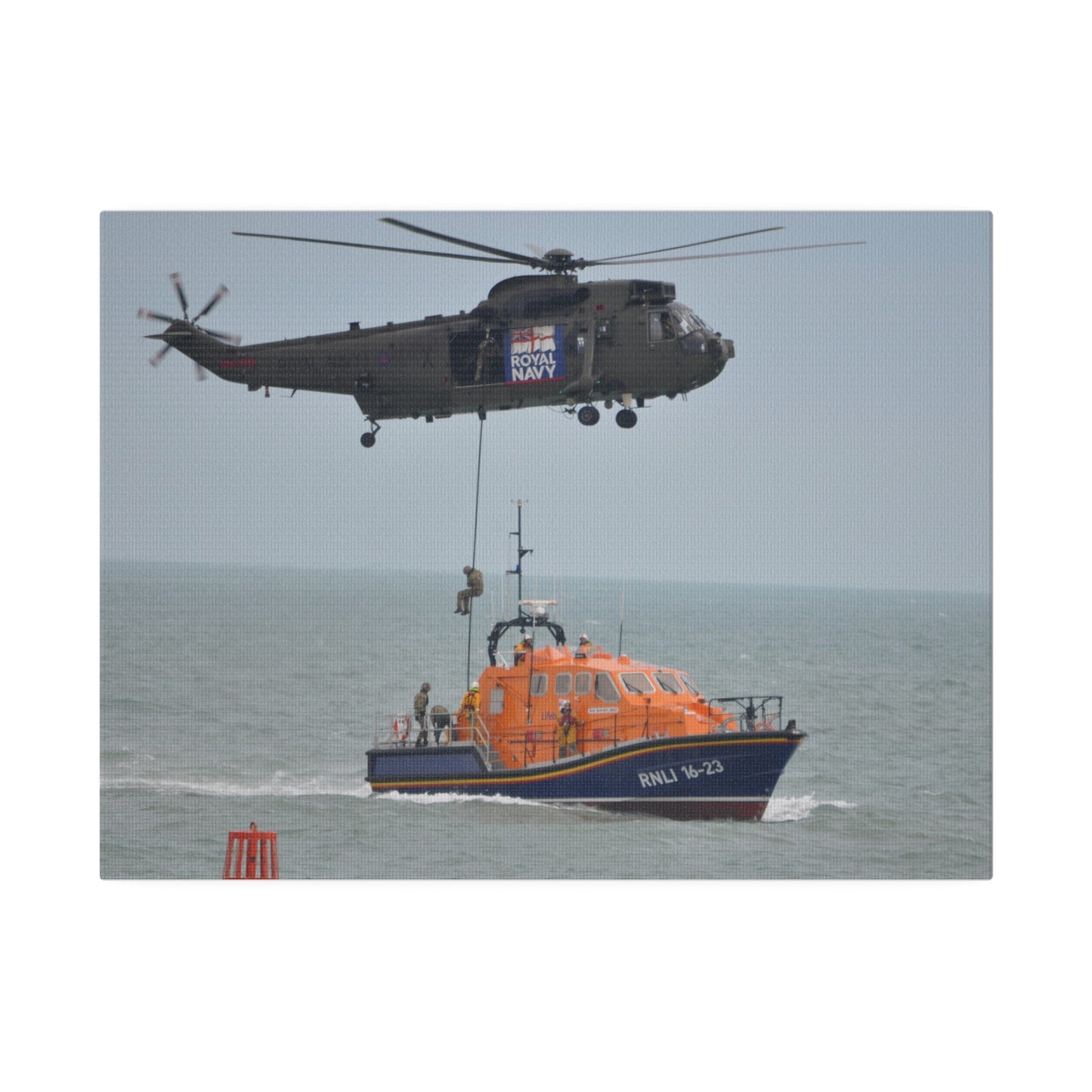 Sea King Helicopter Roping Down Crew Onto The RNLI Lifeboat Canvas