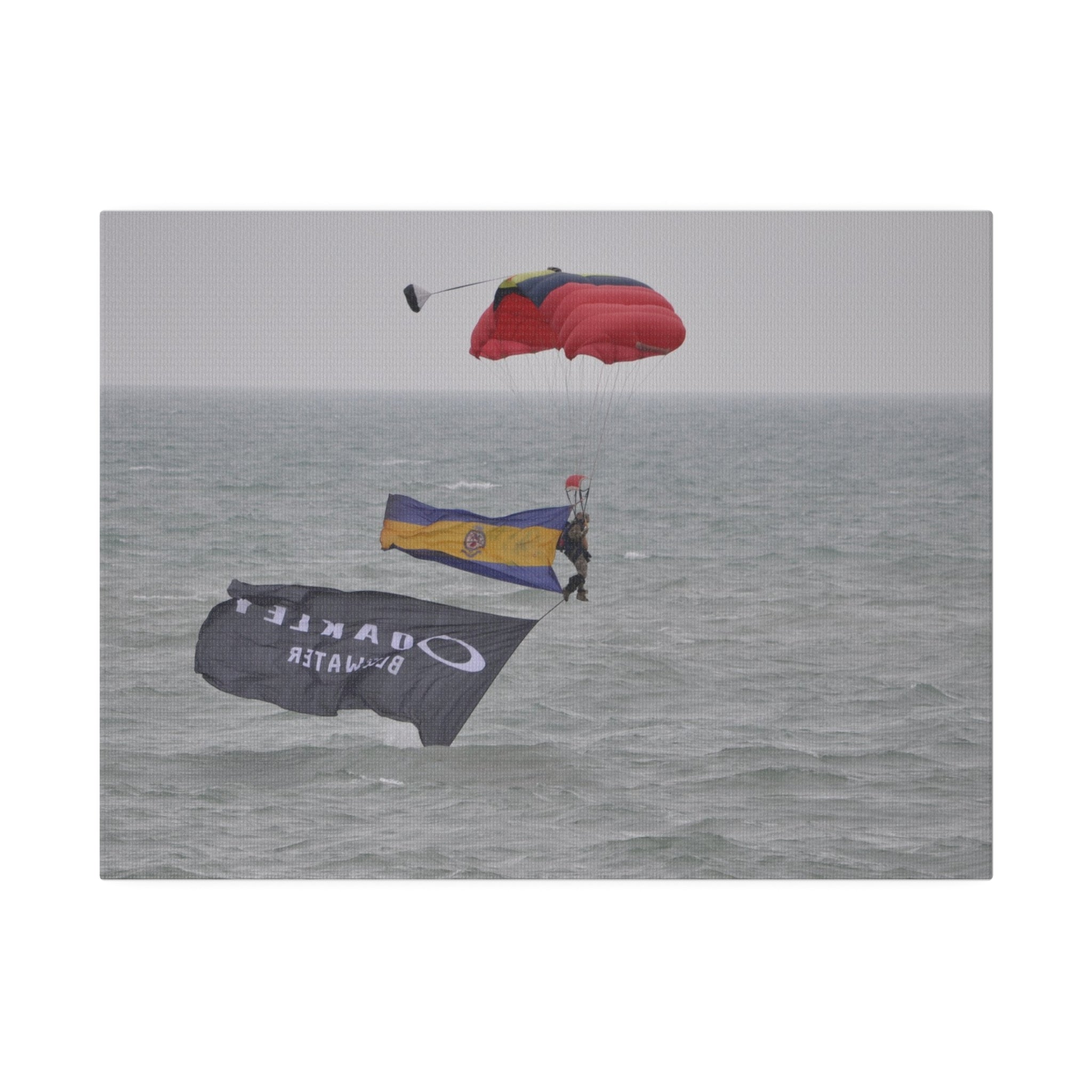Parachuter With Flags Just Above The Sea Canvas - The Trio Synergize Group