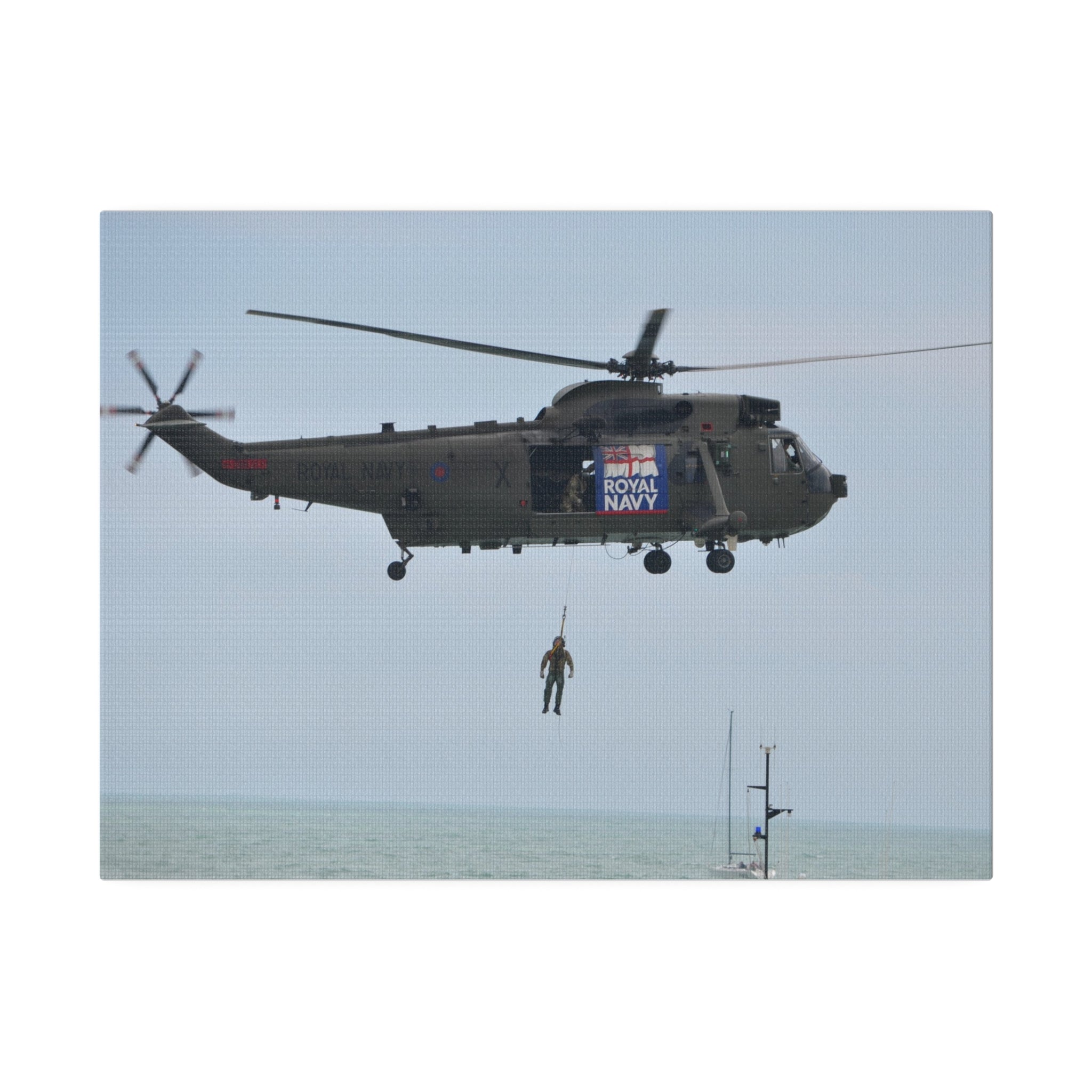 Sea King Helicopter Winching A Crew Member Mid-Air Canvas - The Trio Synergize Group