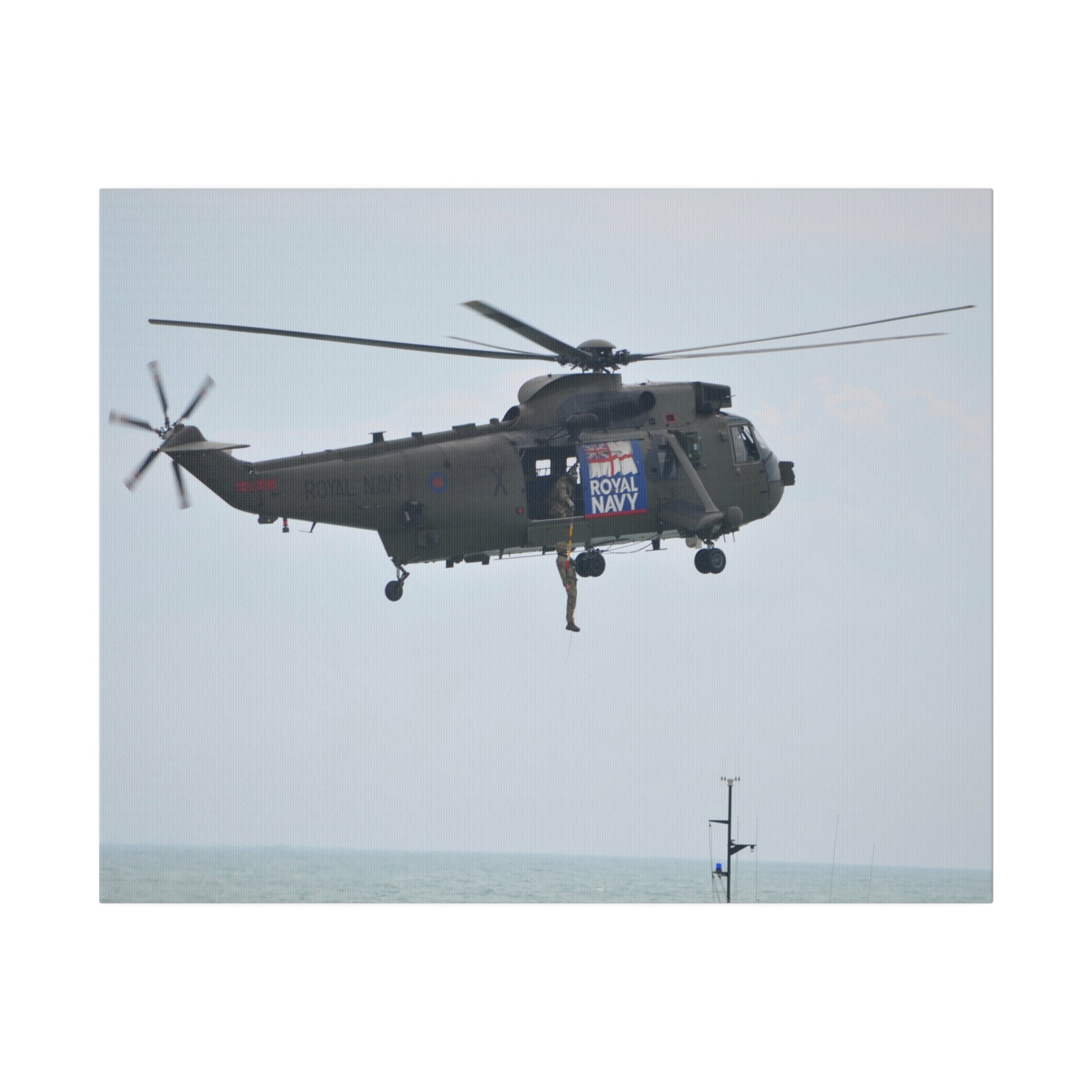 Sea King Helicopter Winching Up Crew Near The Door Canvas - The Trio Synergize Group