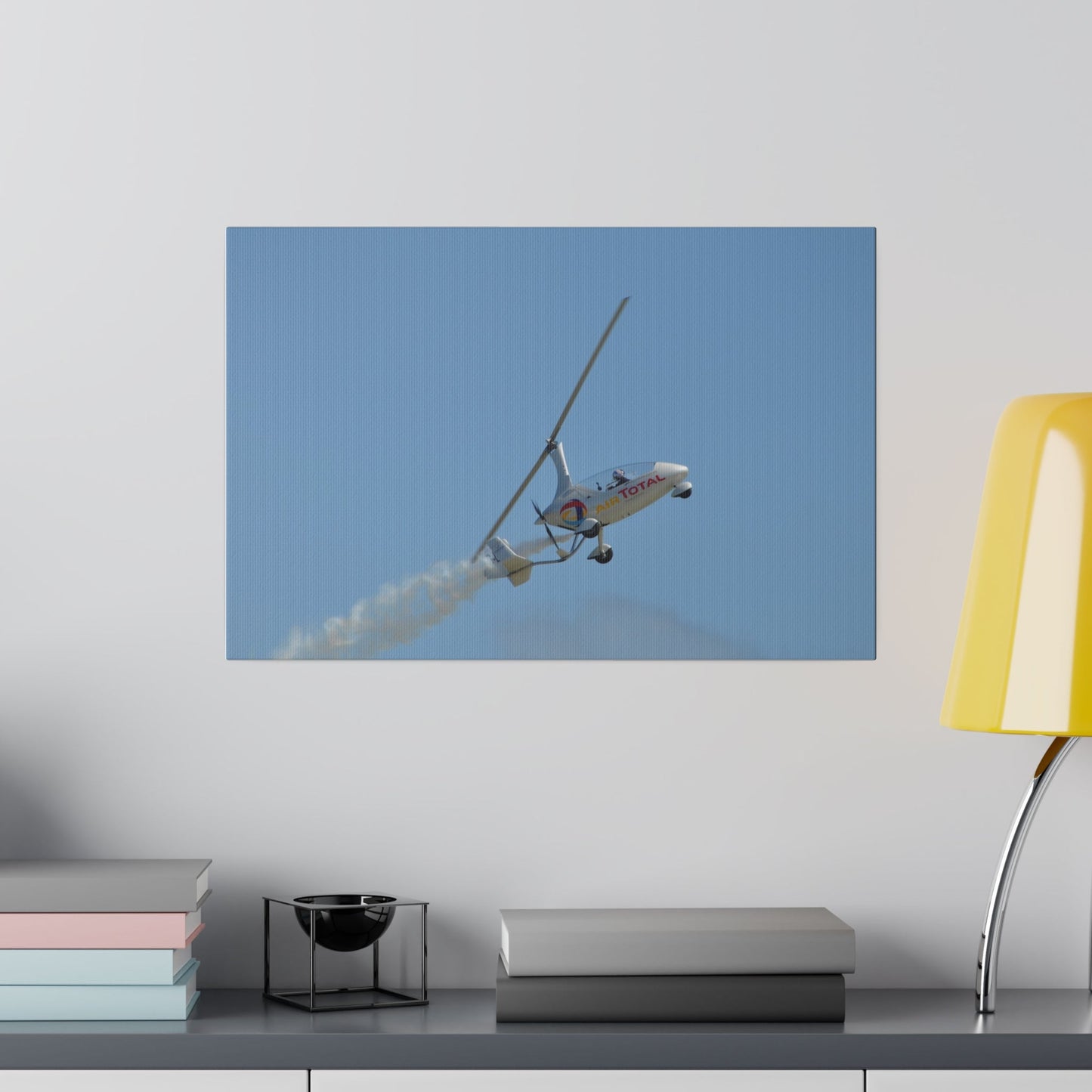 AutoGyro Flying From The Left With Smoke Climbing Canvas - The Trio Synergize Group