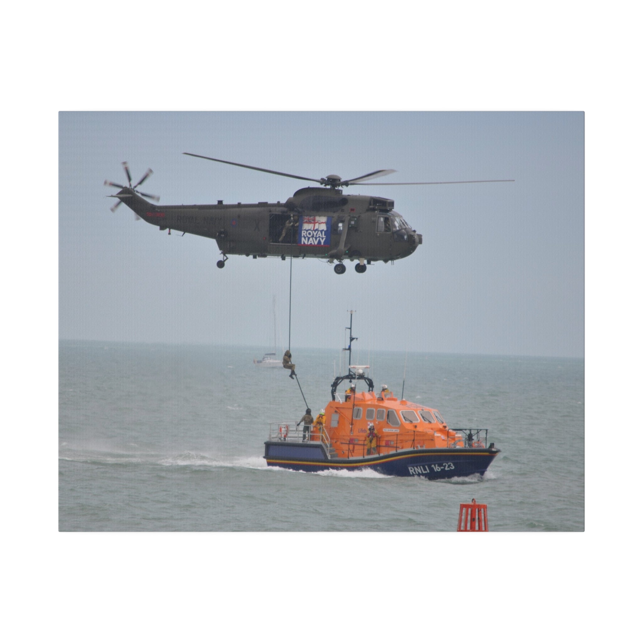 Sea King Helicopter Roping Crew Onto An RNLI Lifeboat Canvas - The Trio Synergize Group