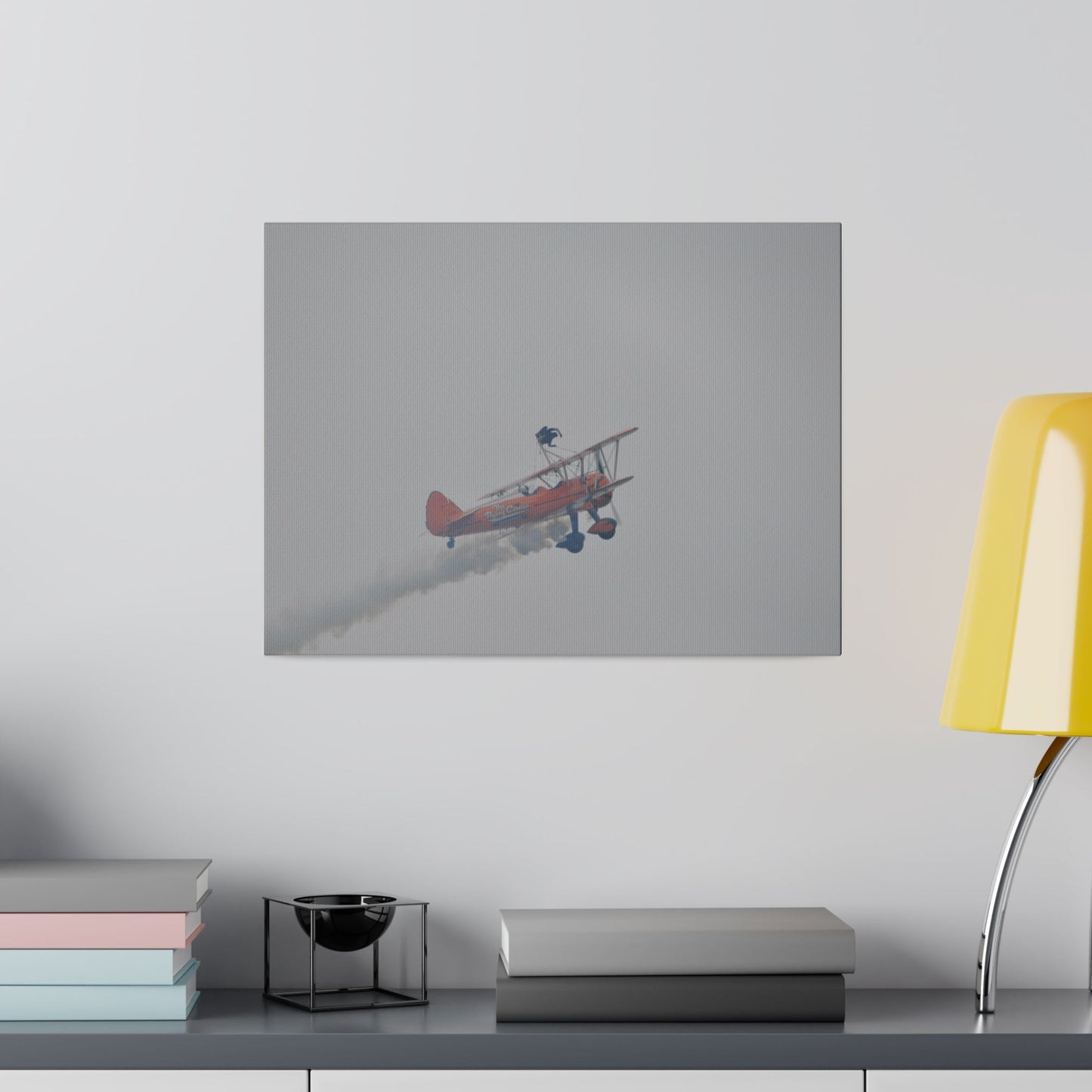 Single Wing Walker Flying From The Left With Side View Ascending, With Smoke And Person Laying Sideways Close Up, Matte Canvas, Stretched, 0.75" - The Trio Synergize Group
