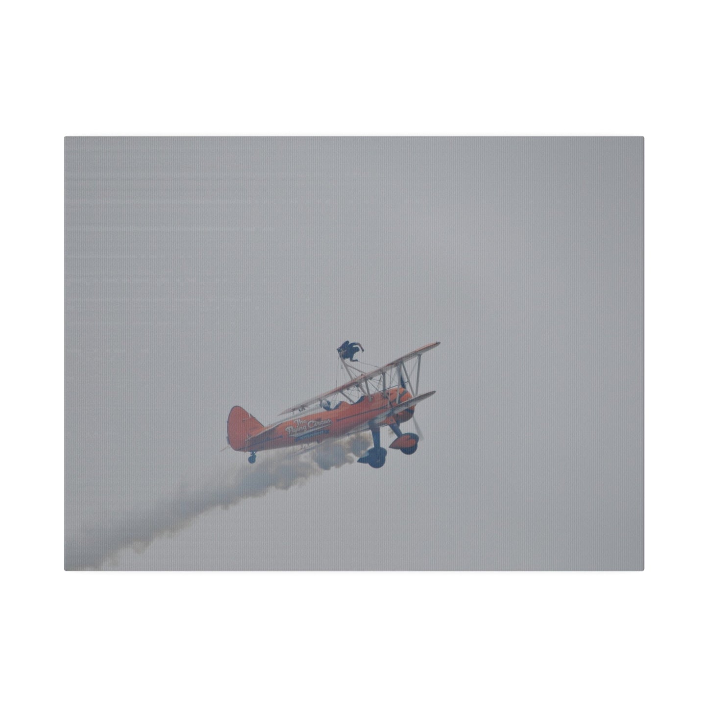 Single Wing Walker Flying From The Left With Side View Ascending, With Smoke And Person Laying Sideways Close Up, Matte Canvas, Stretched, 0.75" - The Trio Synergize Group