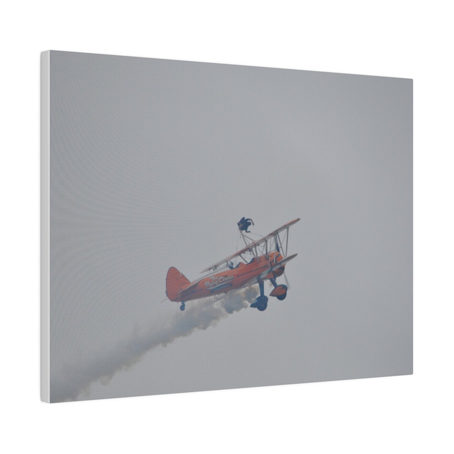 Single Wing Walker Flying From The Left With Side View Ascending, With Smoke And Person Laying Sideways Close Up, Matte Canvas, Stretched, 0.75" - The Trio Synergize Group