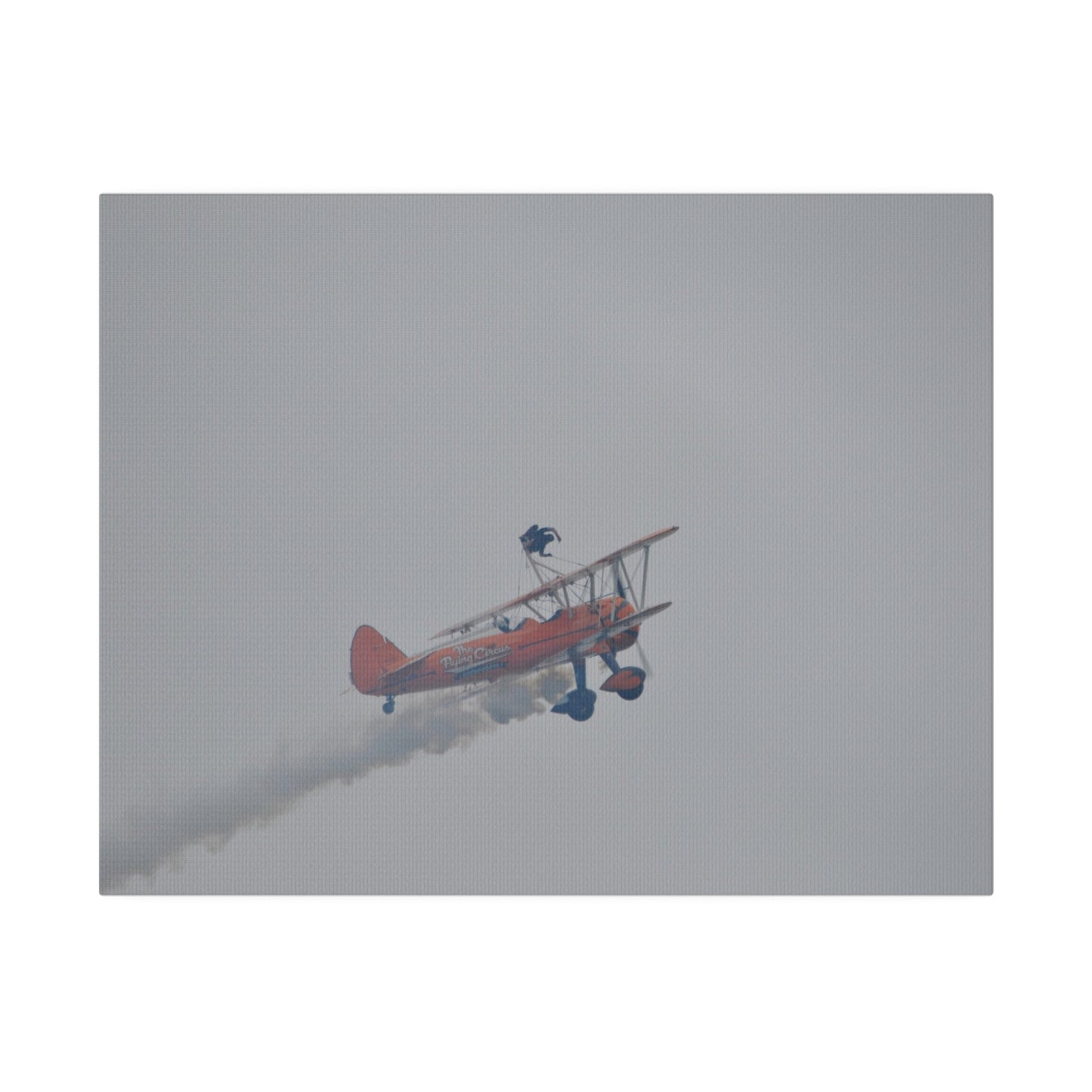 Single Wing Walker Flying From The Left With Side View Ascending, With Smoke And Person Laying Sideways Close Up, Matte Canvas, Stretched, 0.75" - The Trio Synergize Group