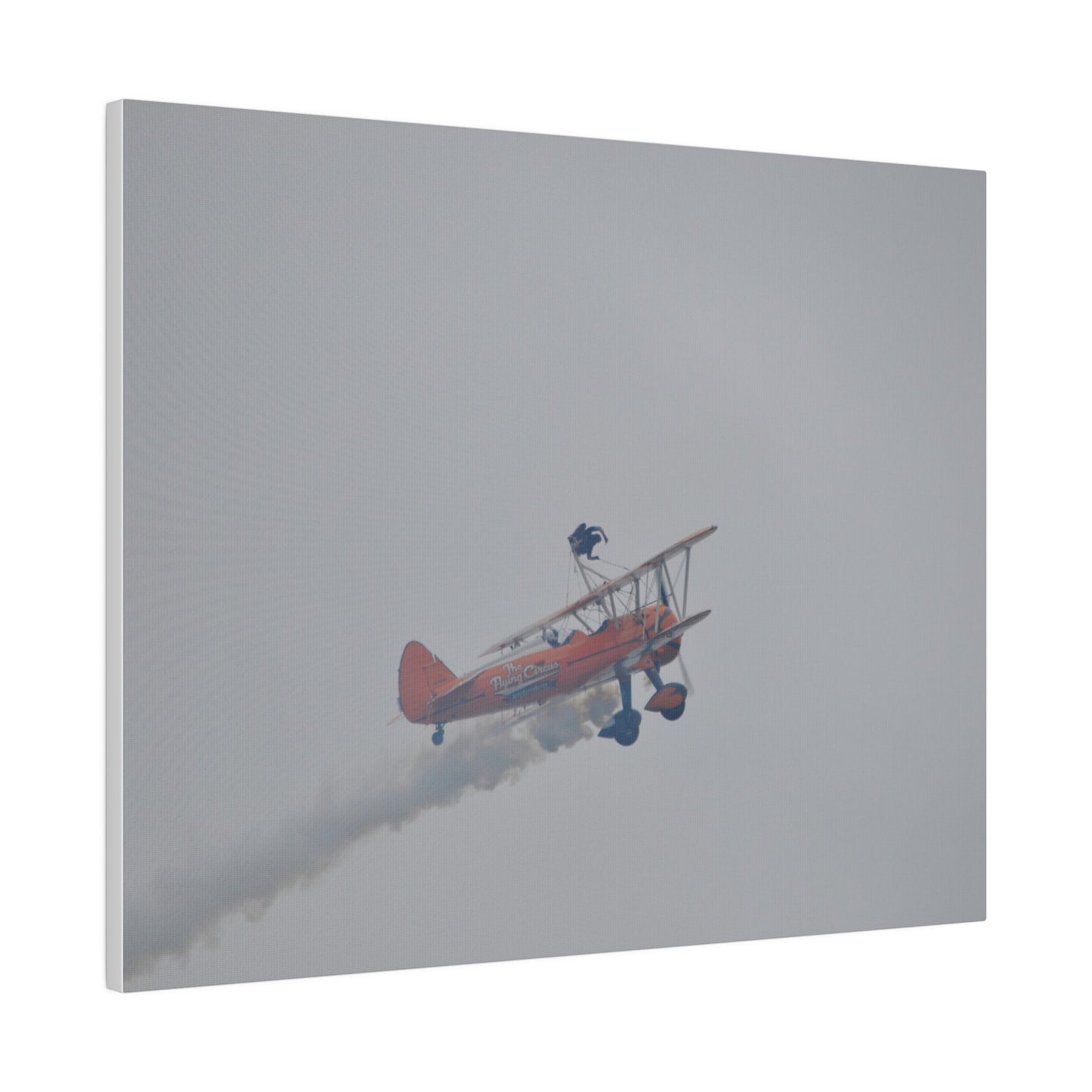 Single Wing Walker Flying From The Left With Side View Ascending, With Smoke And Person Laying Sideways Close Up, Matte Canvas, Stretched, 0.75" - The Trio Synergize Group