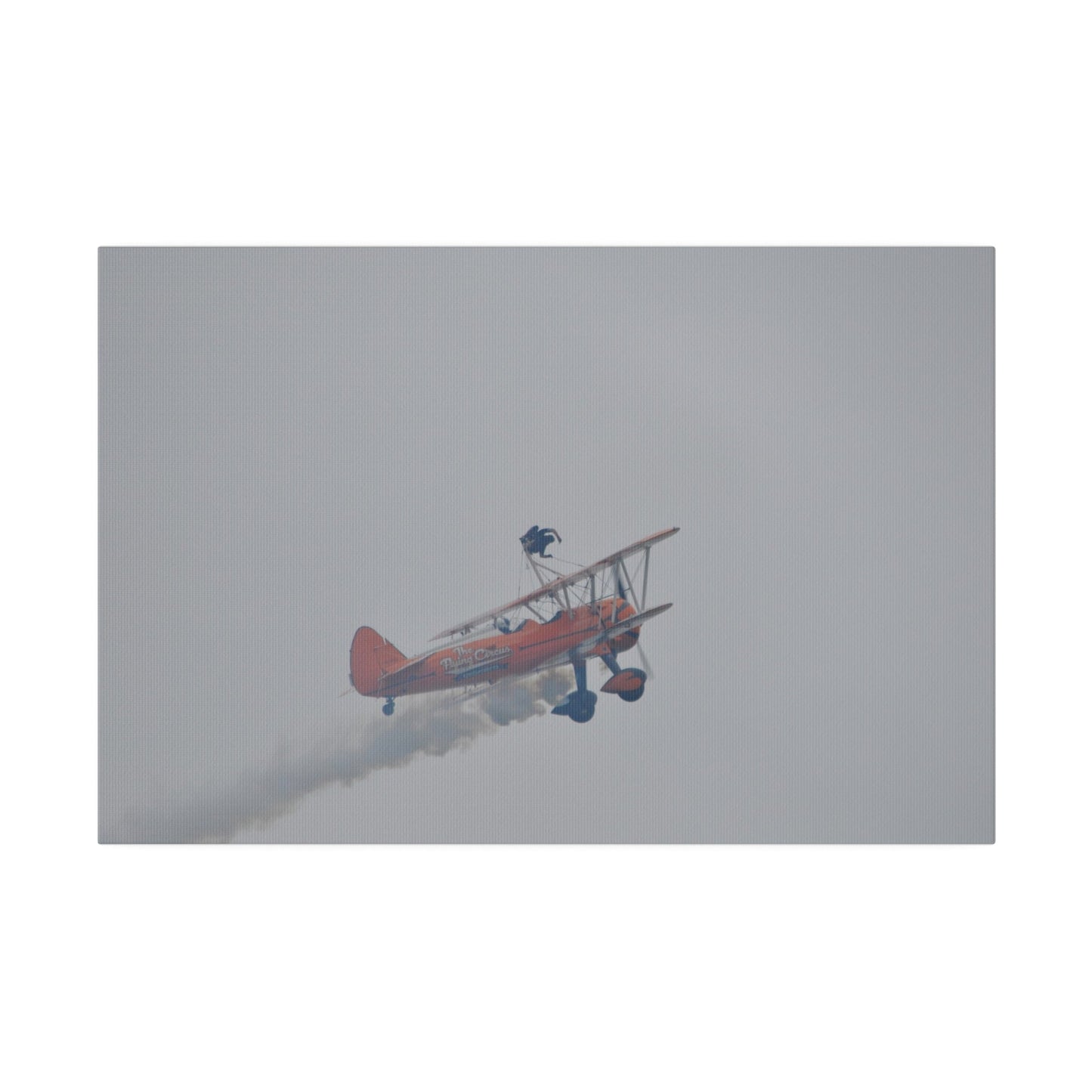 Single Wing Walker Flying From The Left With Side View Ascending, With Smoke And Person Laying Sideways Close Up, Matte Canvas, Stretched, 0.75" - The Trio Synergize Group