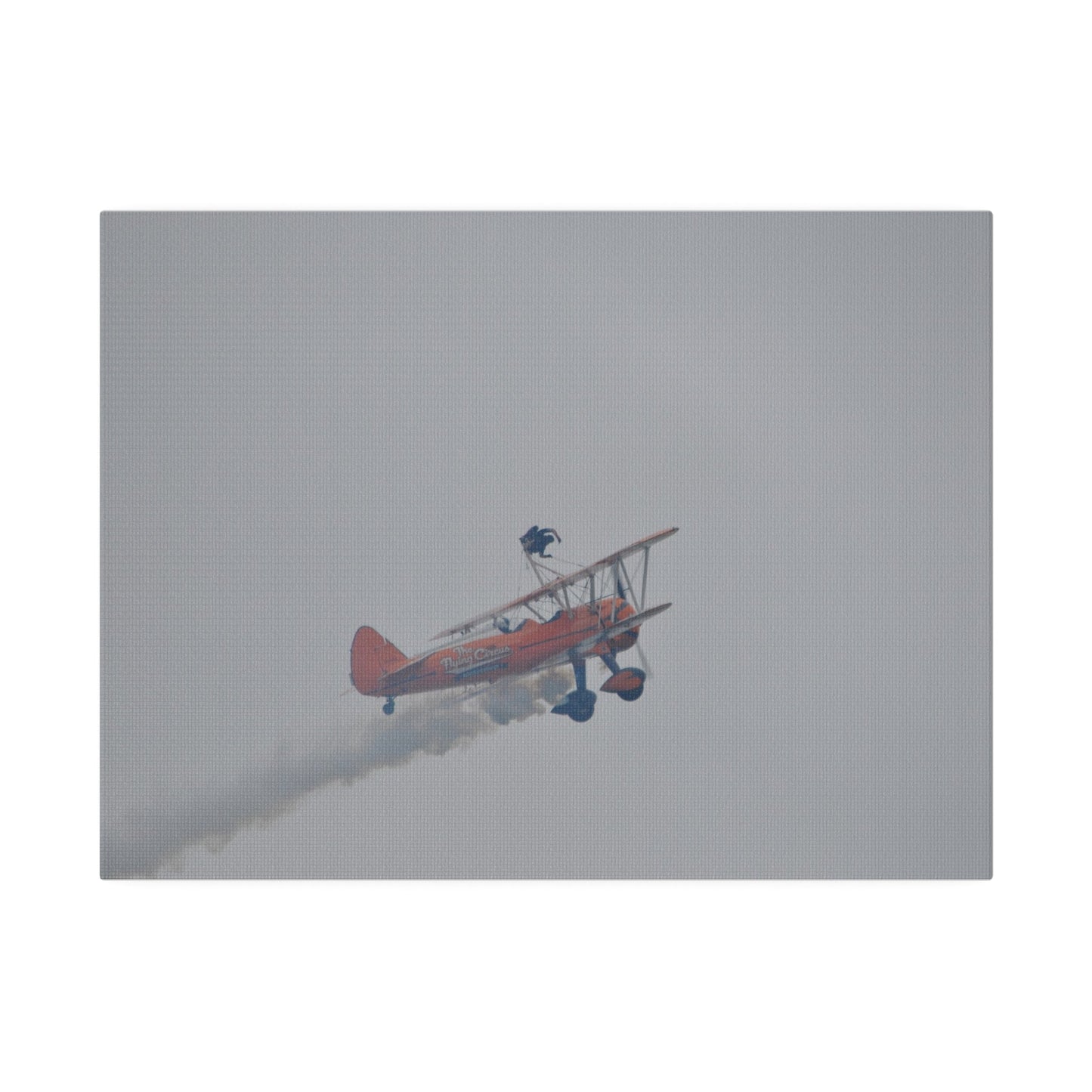Single Wing Walker Flying From The Left With Side View Ascending, With Smoke And Person Laying Sideways Close Up, Matte Canvas, Stretched, 0.75" - The Trio Synergize Group
