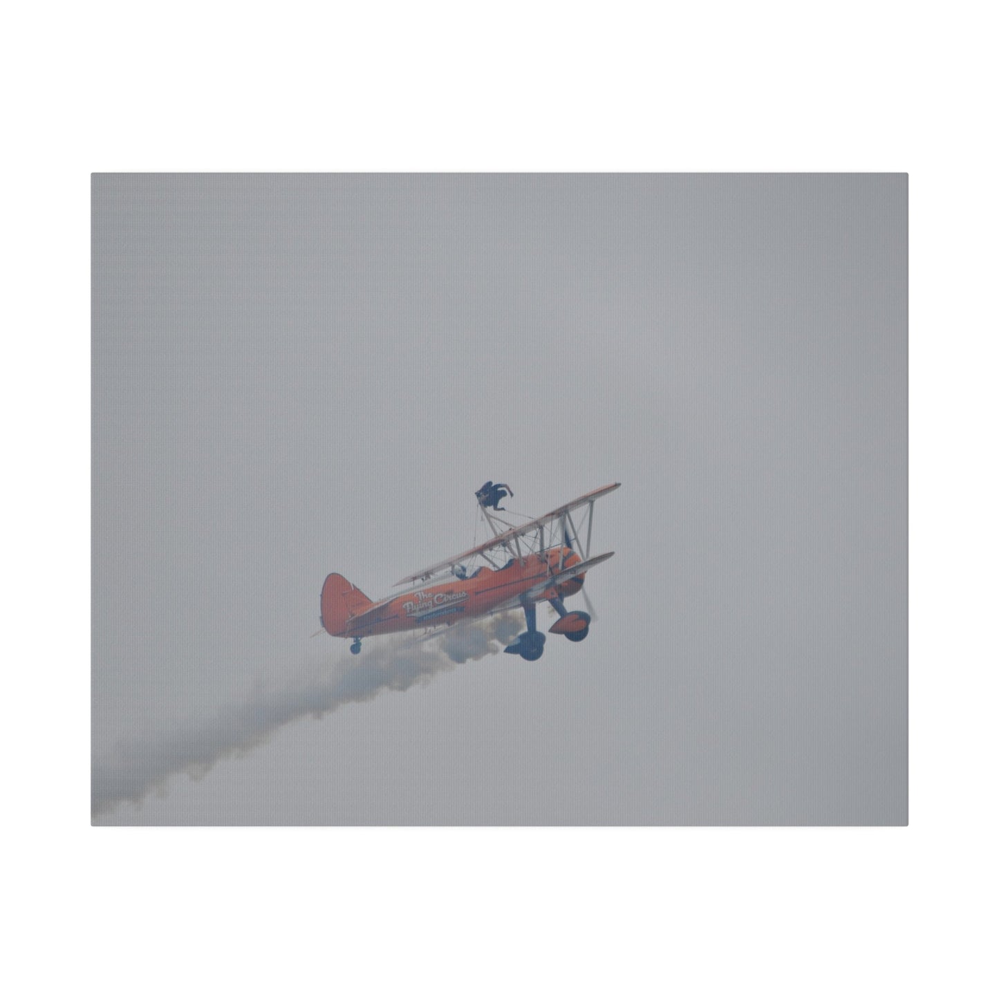 Single Wing Walker Flying From The Left With Side View Ascending, With Smoke And Person Laying Sideways Close Up, Matte Canvas, Stretched, 0.75" - The Trio Synergize Group