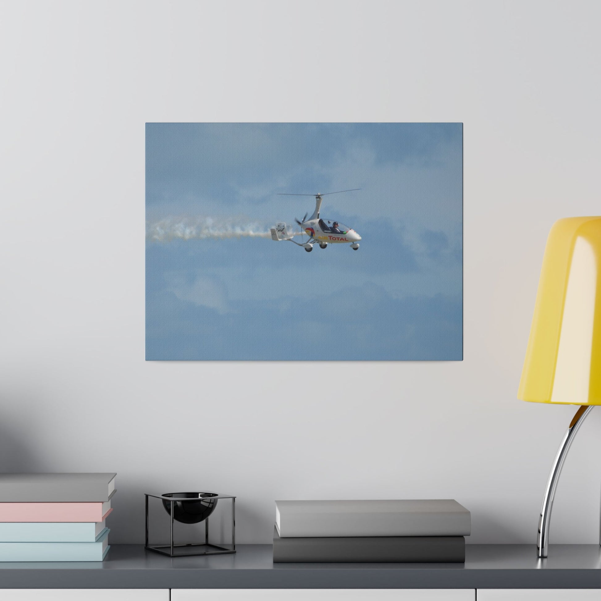 AutoGyro Flying From The Left With Smoke, Pilot Looking Over, Matte Canvas, Stretched, 0.75" - The Trio Synergize Group