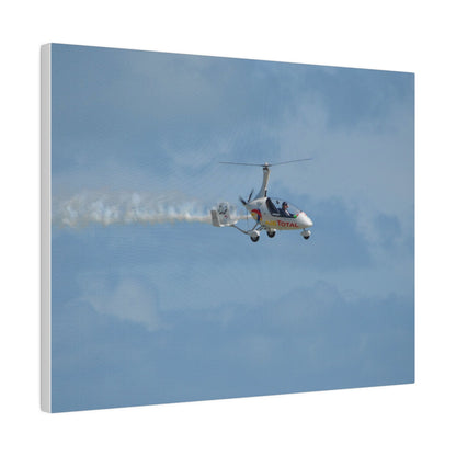 AutoGyro Flying From The Left With Smoke, Pilot Looking Over, Matte Canvas, Stretched, 0.75" - The Trio Synergize Group