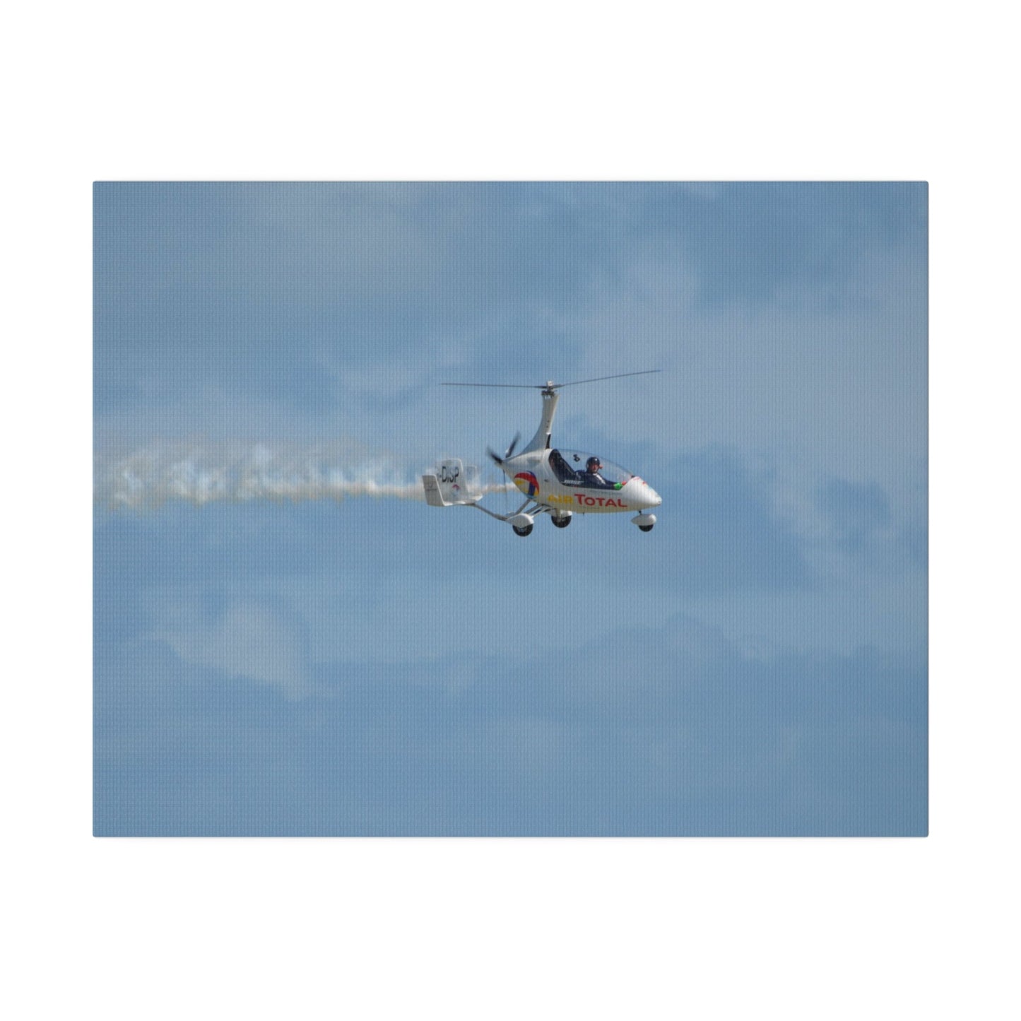 AutoGyro Flying From The Left With Smoke, Pilot Looking Over, Matte Canvas, Stretched, 0.75" - The Trio Synergize Group
