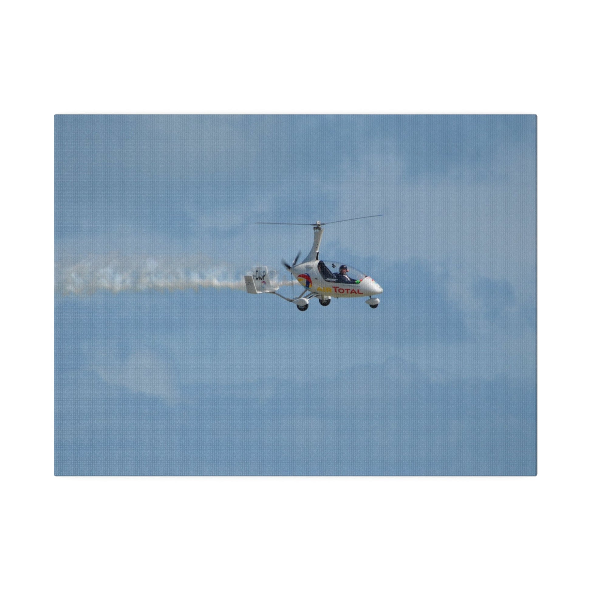 AutoGyro Flying From The Left With Smoke, Pilot Looking Over, Matte Canvas, Stretched, 0.75" - The Trio Synergize Group