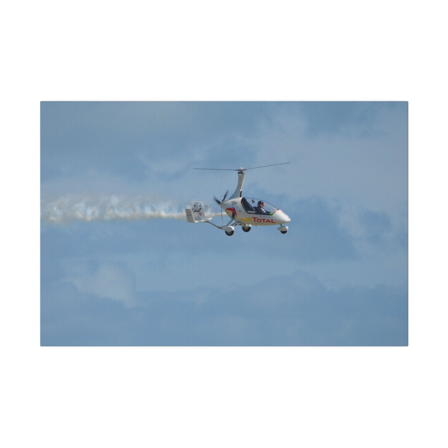 AutoGyro Flying From The Left With Smoke, Pilot Looking Over, Matte Canvas, Stretched, 0.75" - The Trio Synergize Group