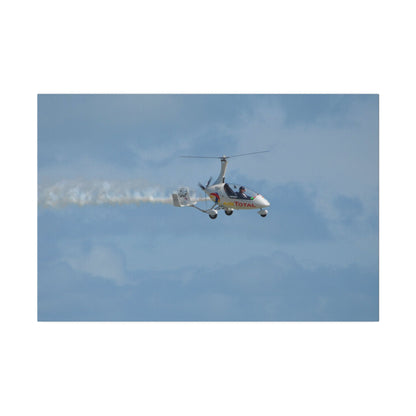 AutoGyro Flying From The Left With Smoke, Pilot Looking Over, Matte Canvas, Stretched, 0.75" - The Trio Synergize Group