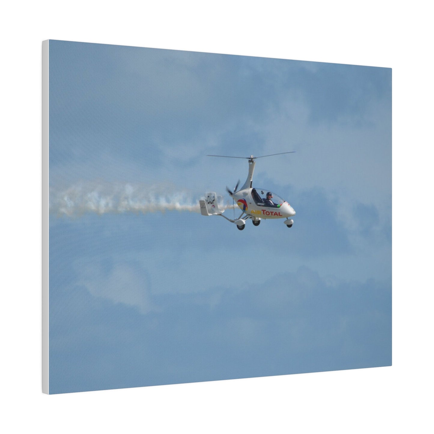 AutoGyro Flying From The Left With Smoke, Pilot Looking Over, Matte Canvas, Stretched, 0.75" - The Trio Synergize Group