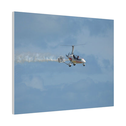 AutoGyro Flying From The Left With Smoke, Pilot Looking Over, Matte Canvas, Stretched, 0.75" - The Trio Synergize Group