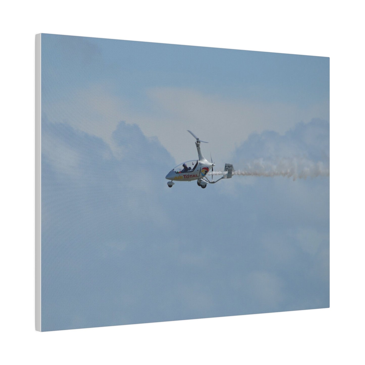 AutoGyro Flying From The Right With Smoke, Matte Canvas, Stretched, 0.75" - The Trio Synergize Group