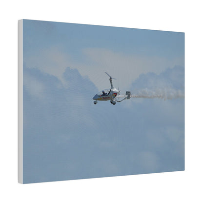 AutoGyro Flying From The Right With Smoke, Matte Canvas, Stretched, 0.75" - The Trio Synergize Group