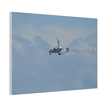AutoGyro Flying From The Right With Smoke, Matte Canvas, Stretched, 0.75" - The Trio Synergize Group