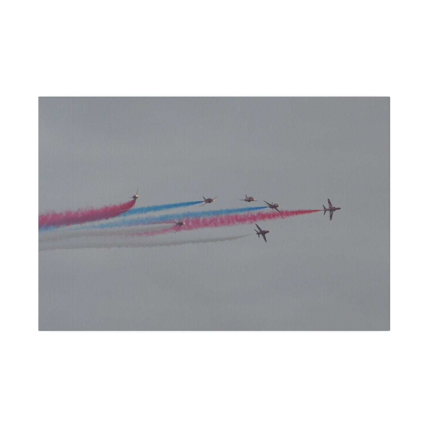 Seven Red Arrows Flying From The Left In Formation With slight Angles And With Blue, White And Red Smoke Close To Each Other, Matte Canvas, Stretched, 0.75" - The Trio Synergize Group