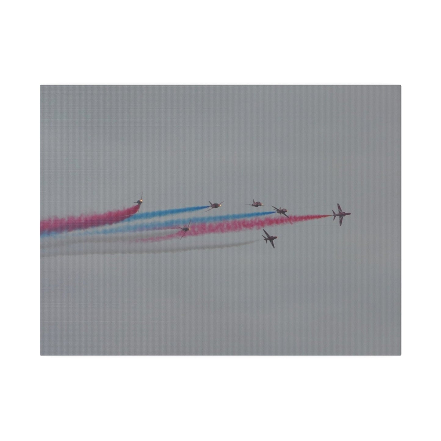 Seven Red Arrows Flying From The Left In Formation With slight Angles And With Blue, White And Red Smoke Close To Each Other, Matte Canvas, Stretched, 0.75" - The Trio Synergize Group