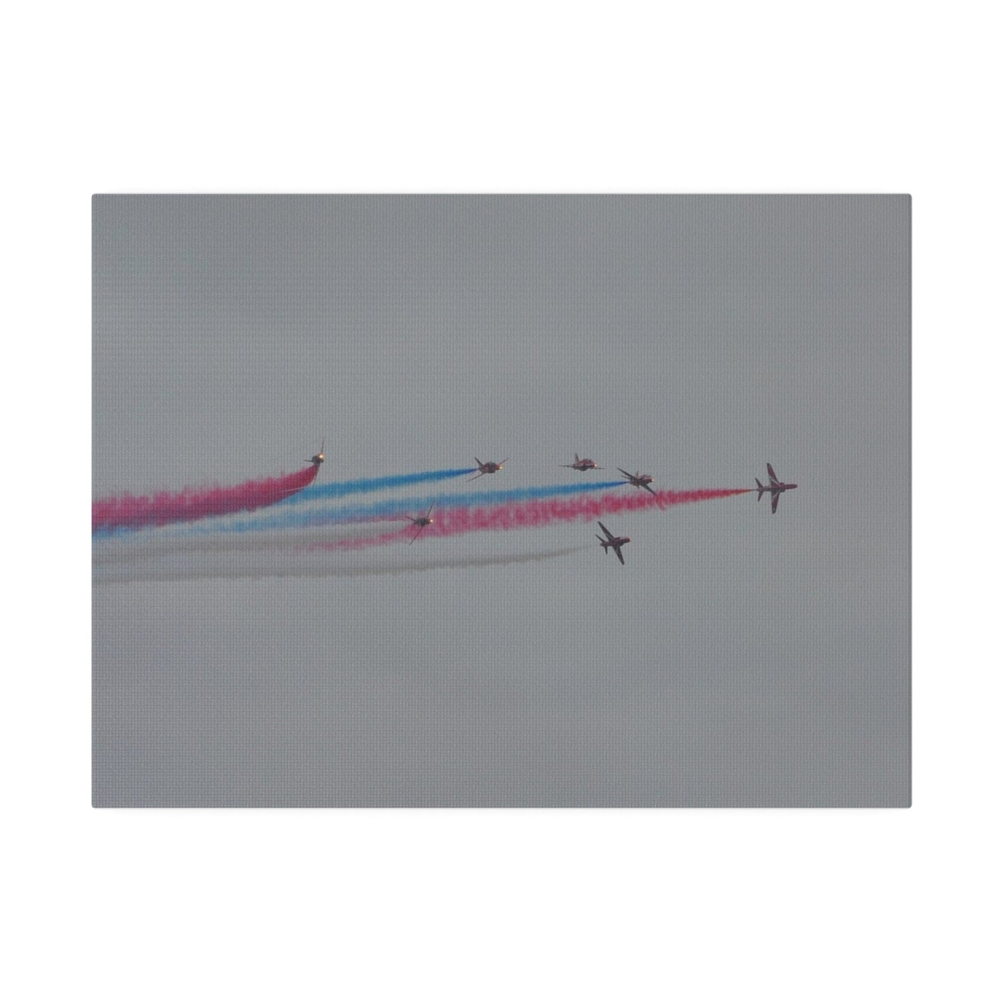 Seven Red Arrows Flying From The Left In Formation With slight Angles And With Blue, White And Red Smoke Close To Each Other, Matte Canvas, Stretched, 0.75" - The Trio Synergize Group