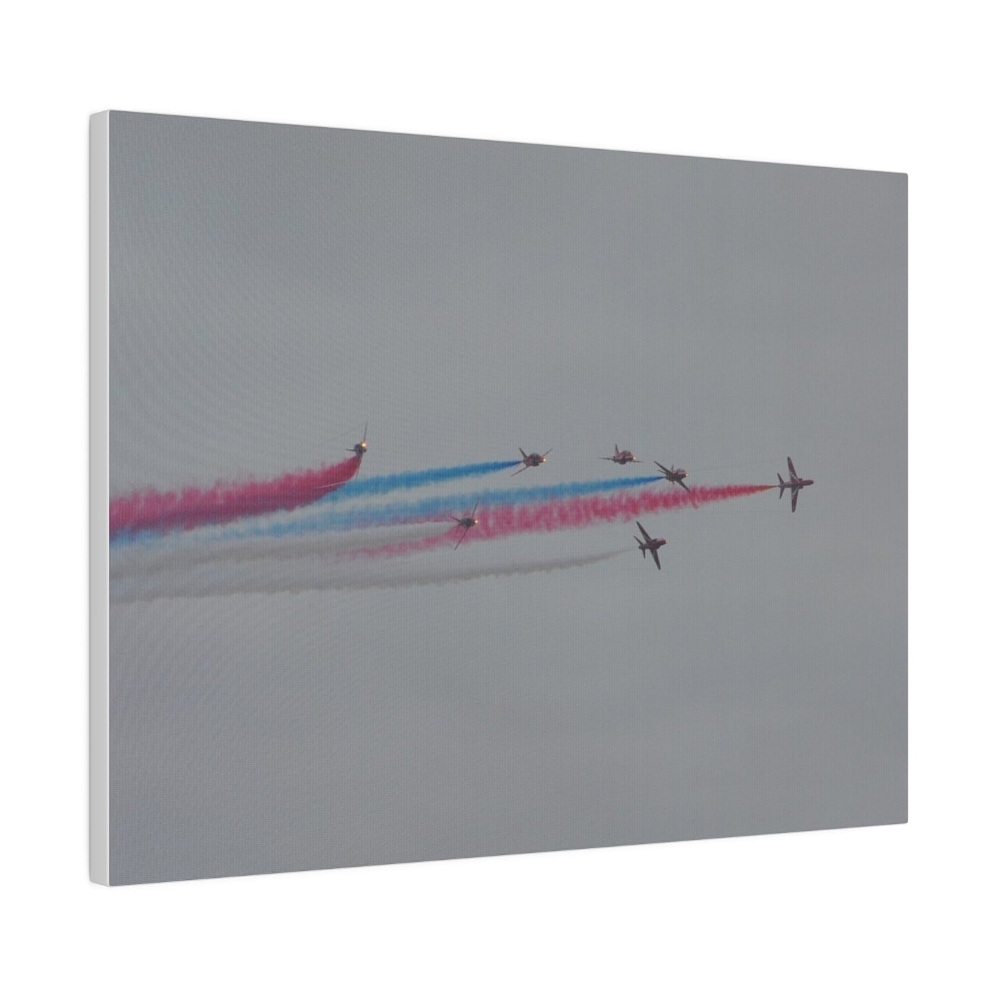 Seven Red Arrows Flying From The Left In Formation With slight Angles And With Blue, White And Red Smoke Close To Each Other, Matte Canvas, Stretched, 0.75" - The Trio Synergize Group