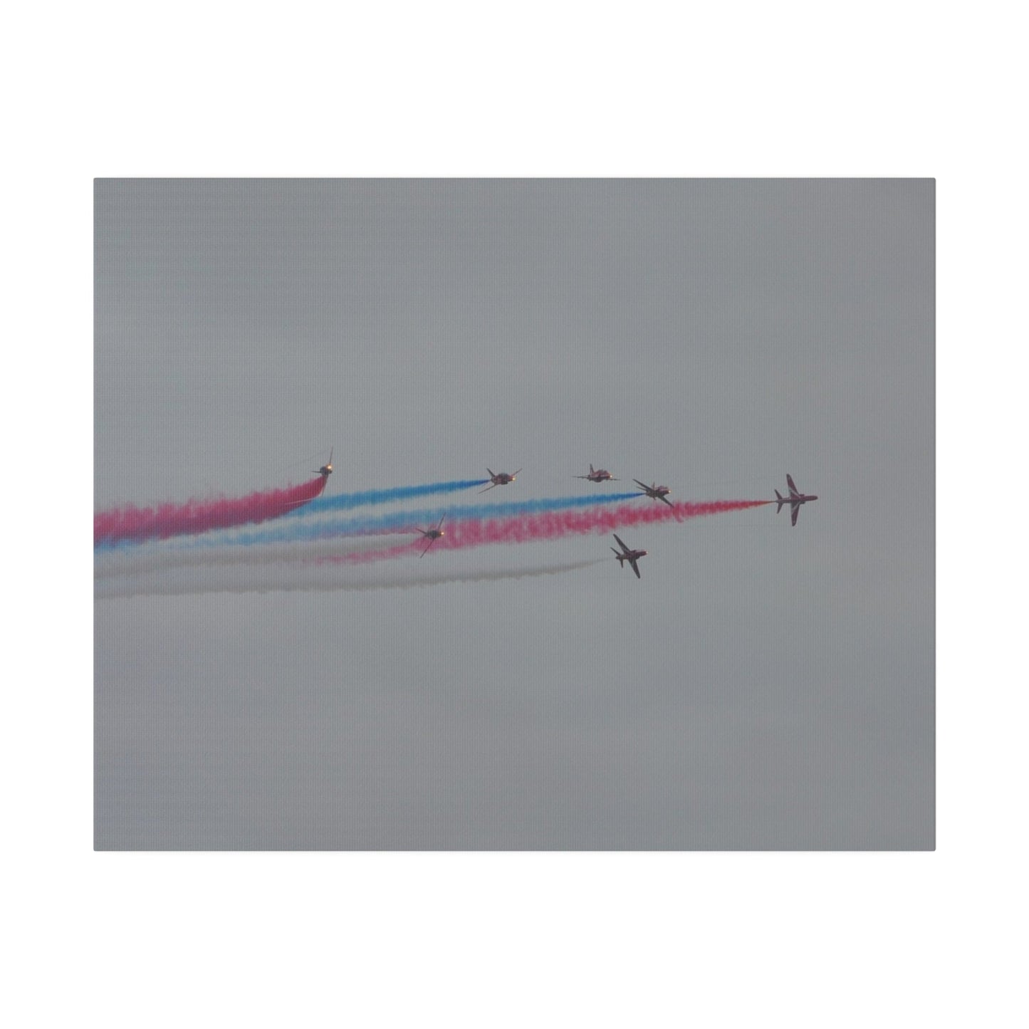 Seven Red Arrows Flying From The Left In Formation With slight Angles And With Blue, White And Red Smoke Close To Each Other, Matte Canvas, Stretched, 0.75" - The Trio Synergize Group