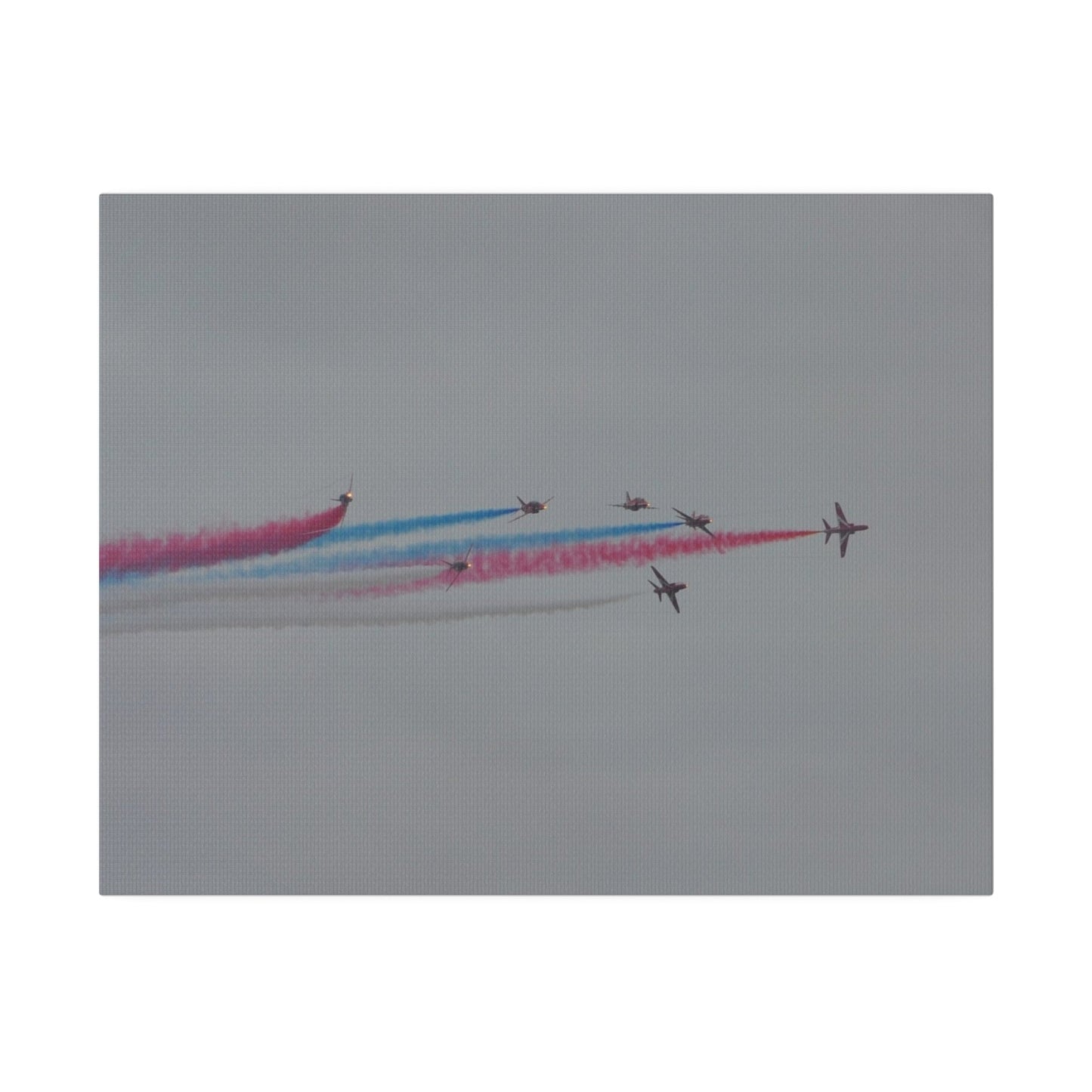 Seven Red Arrows Flying From The Left In Formation With slight Angles And With Blue, White And Red Smoke Close To Each Other, Matte Canvas, Stretched, 0.75" - The Trio Synergize Group