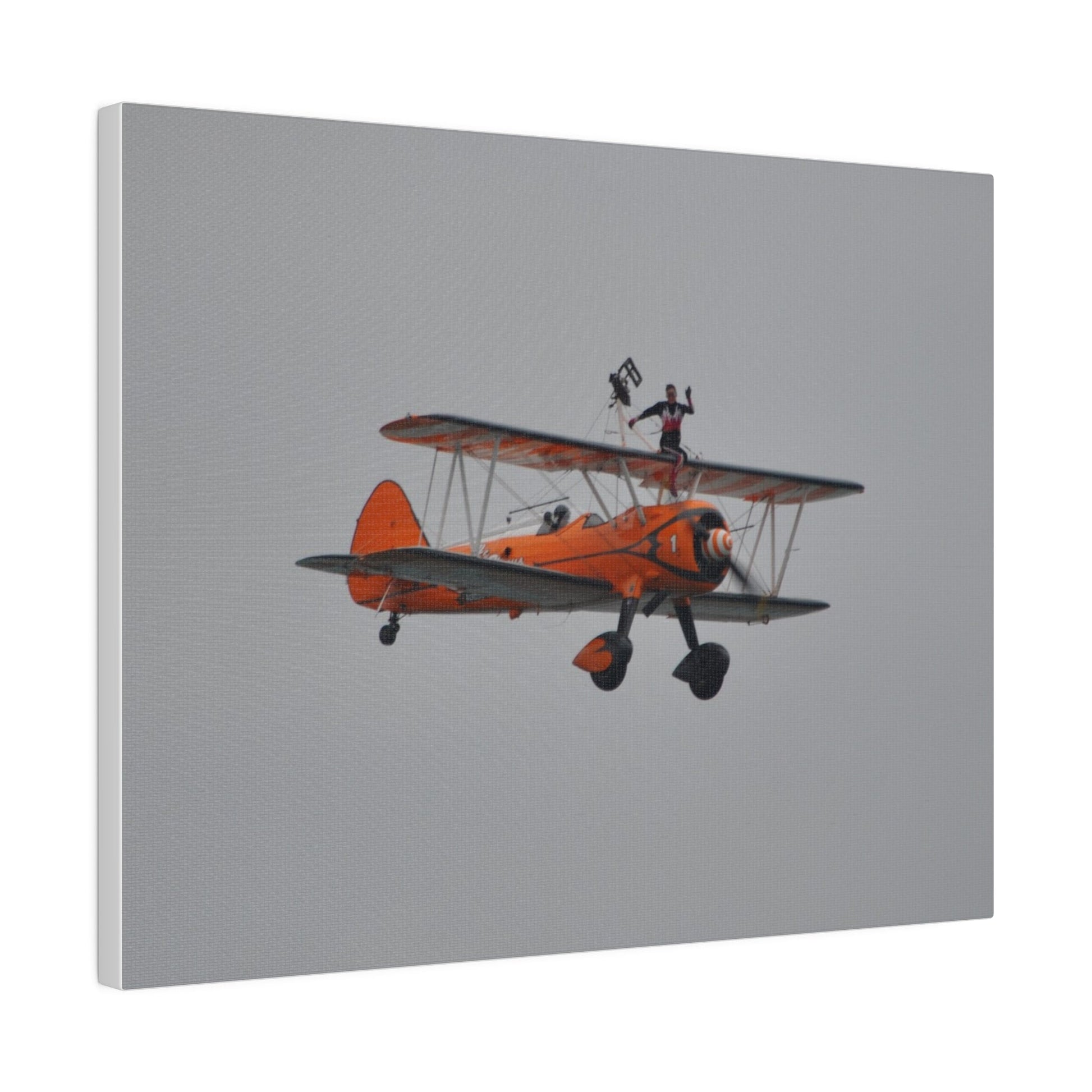 Single Wing Walker Flying From The Left, Front View Much Closer, Person Sitting On The Wing Without The Harness Looking Towards Us, Matte Canvas, Stretched, 0.75" - The Trio Synergize Group