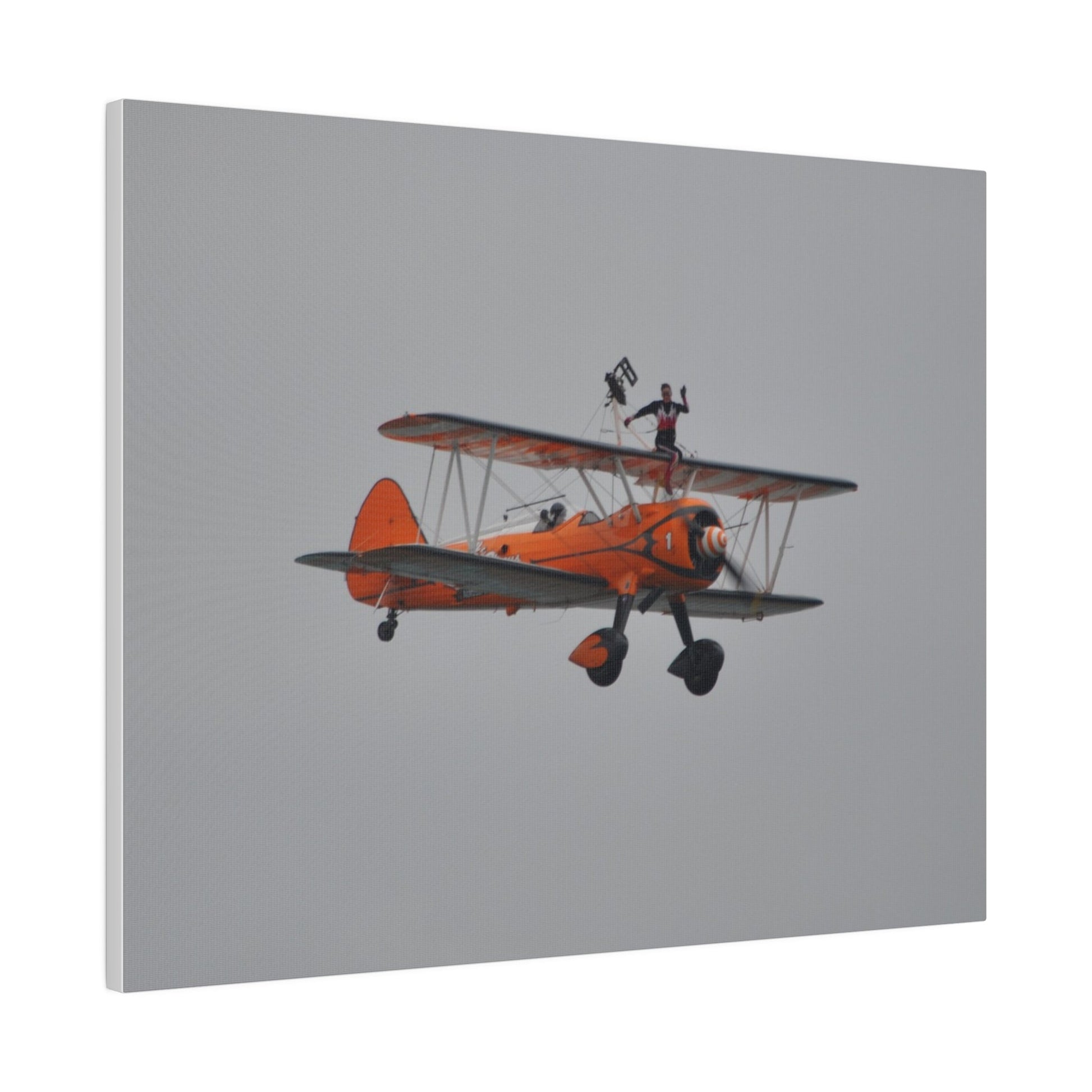 Single Wing Walker Flying From The Left, Front View Much Closer, Person Sitting On The Wing Without The Harness Looking Towards Us, Matte Canvas, Stretched, 0.75" - The Trio Synergize Group
