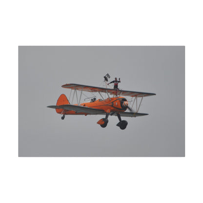 Single Wing Walker Flying From The Left, Front View Much Closer, Person Sitting On The Wing Without The Harness Looking Towards Us, Matte Canvas, Stretched, 0.75" - The Trio Synergize Group