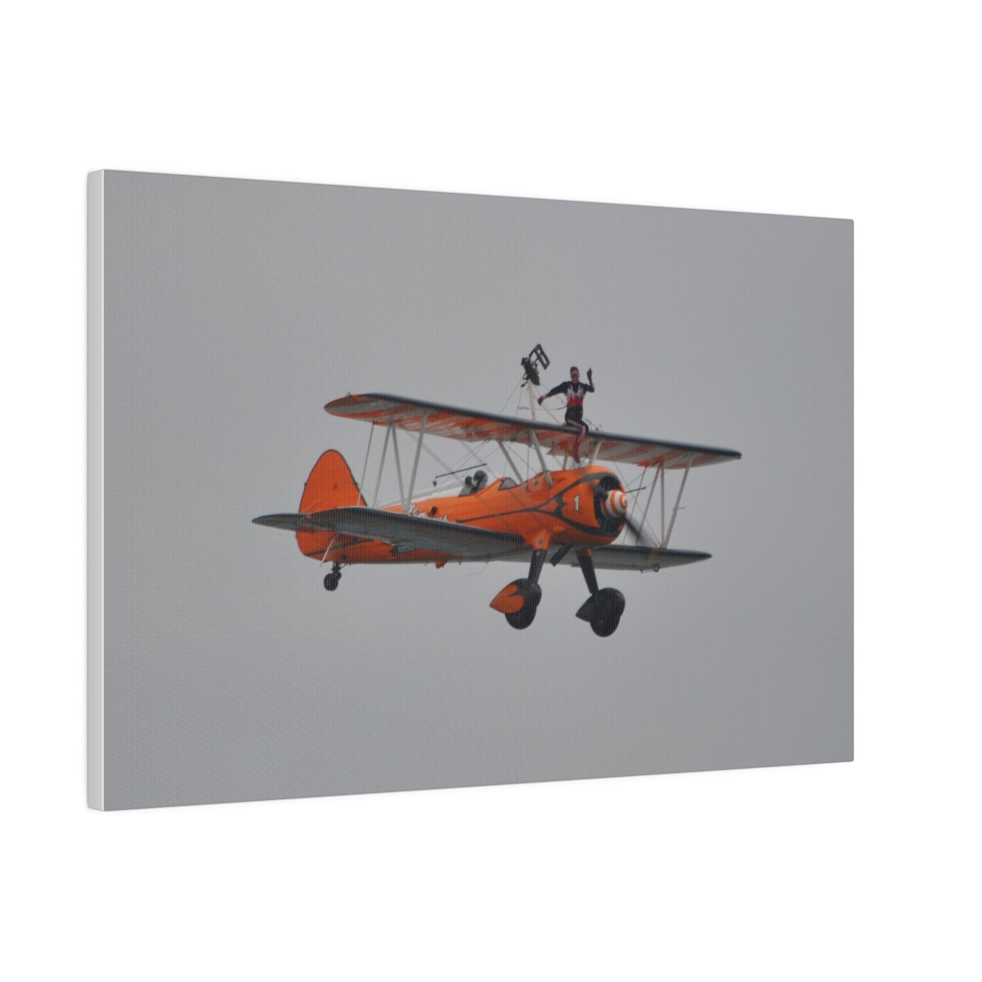 Single Wing Walker Flying From The Left, Front View Much Closer, Person Sitting On The Wing Without The Harness Looking Towards Us, Matte Canvas, Stretched, 0.75" - The Trio Synergize Group