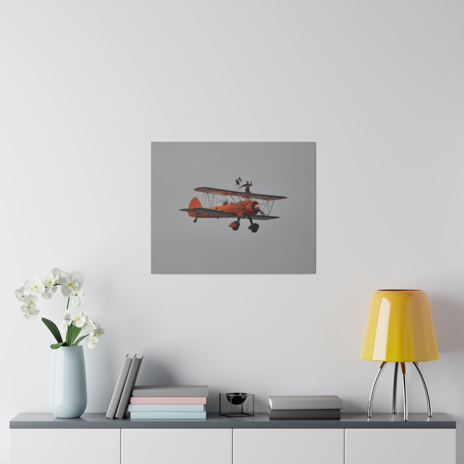 Single Wing Walker Flying From The Left, Front View Much Closer, Person Sitting On The Wing Without The Harness Looking Towards Us, Matte Canvas, Stretched, 0.75" - The Trio Synergize Group