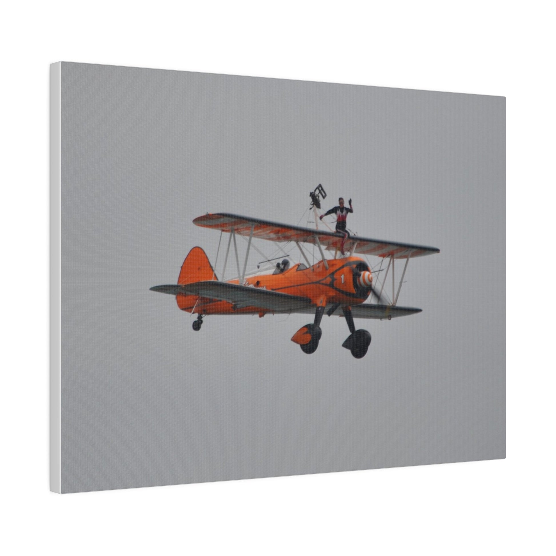 Single Wing Walker Flying From The Left, Front View Much Closer, Person Sitting On The Wing Without The Harness Looking Towards Us, Matte Canvas, Stretched, 0.75" - The Trio Synergize Group