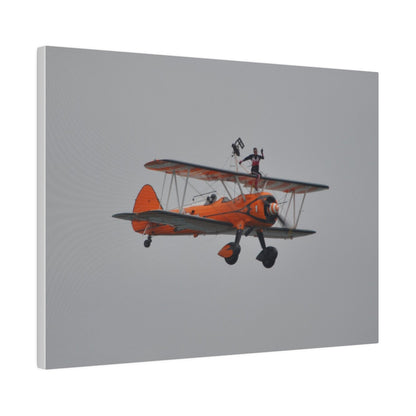 Single Wing Walker Flying From The Left, Front View Much Closer, Person Sitting On The Wing Without The Harness Looking Towards Us, Matte Canvas, Stretched, 0.75" - The Trio Synergize Group