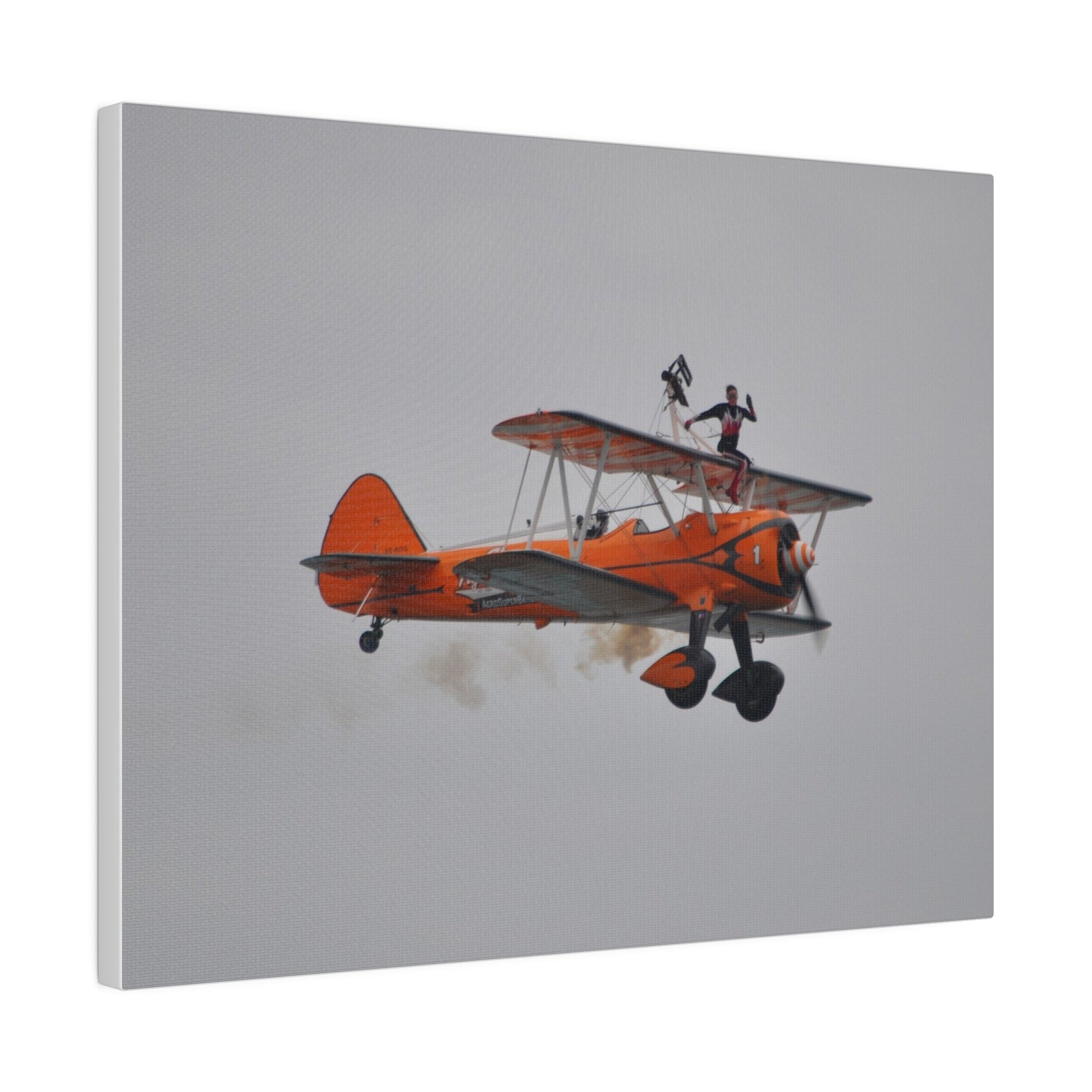Single Wing Walker Flying From The Left, Front View Much Closer, Person Sitting On The Wing Without The Harness Looking Towards Us With Smoke, Matte Canvas, Stretched, 0.75" - The Trio Synergize Group