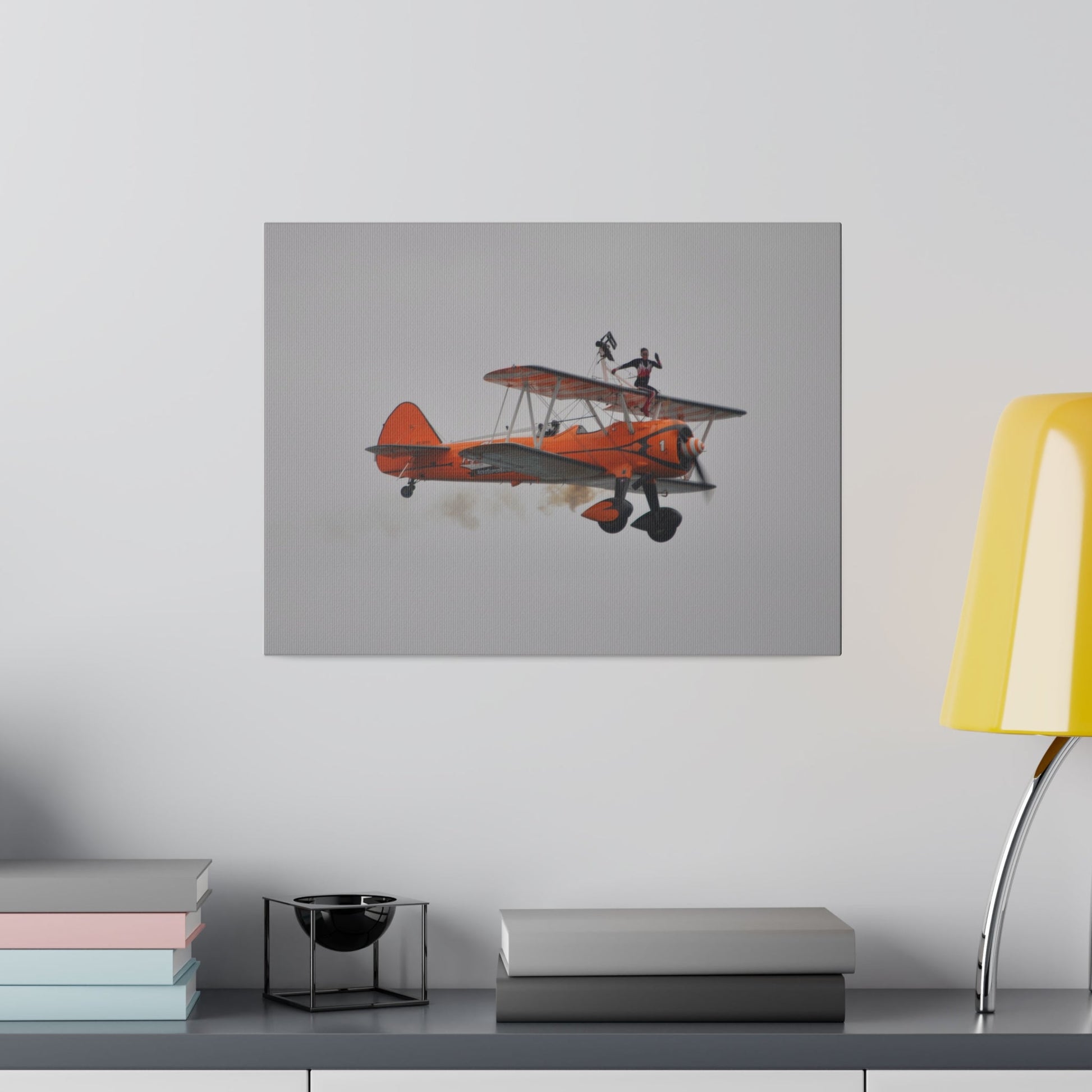 Single Wing Walker Flying From The Left, Front View Much Closer, Person Sitting On The Wing Without The Harness Looking Towards Us With Smoke, Matte Canvas, Stretched, 0.75" - The Trio Synergize Group