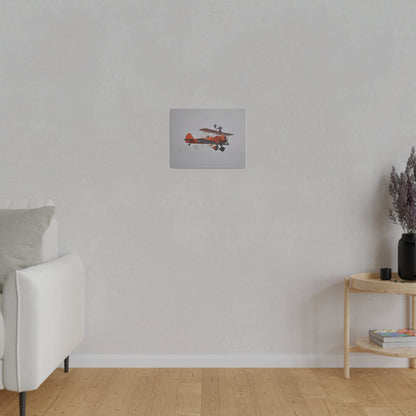 Single Wing Walker Flying From The Left, Front View Much Closer, Person Sitting On The Wing Without The Harness Looking Towards Us With Smoke, Matte Canvas, Stretched, 0.75" - The Trio Synergize Group