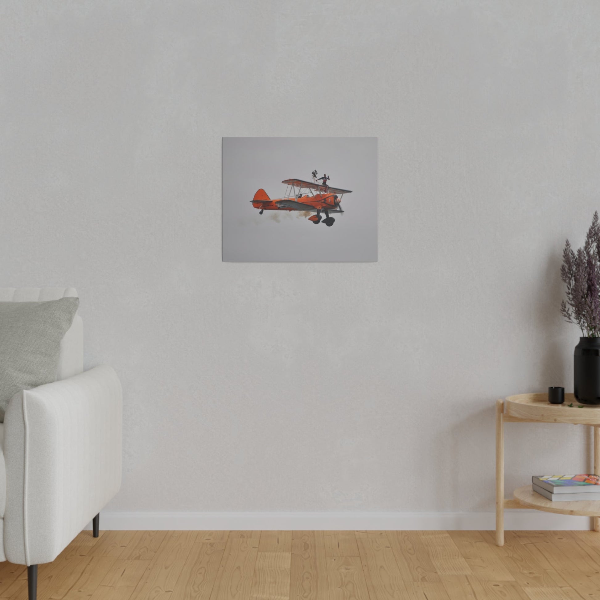 Single Wing Walker Flying From The Left, Front View Much Closer, Person Sitting On The Wing Without The Harness Looking Towards Us With Smoke, Matte Canvas, Stretched, 0.75" - The Trio Synergize Group