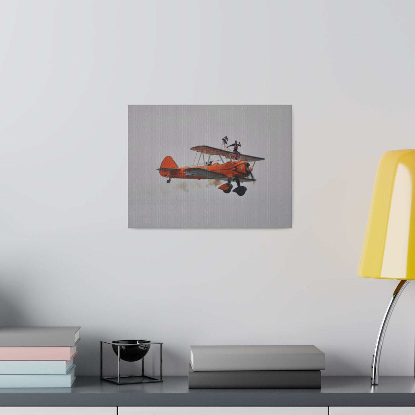 Single Wing Walker Flying From The Left, Front View Much Closer, Person Sitting On The Wing Without The Harness Looking Towards Us With Smoke, Matte Canvas, Stretched, 0.75" - The Trio Synergize Group