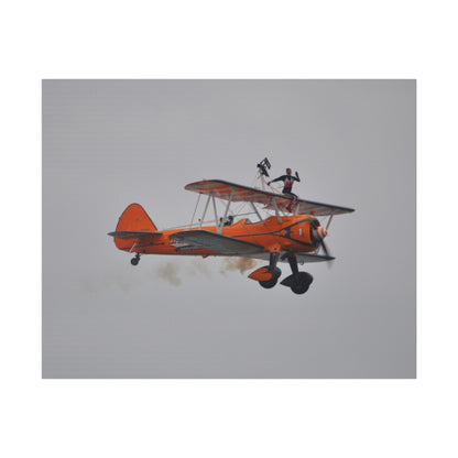 Single Wing Walker Flying From The Left, Front View Much Closer, Person Sitting On The Wing Without The Harness Looking Towards Us With Smoke, Matte Canvas, Stretched, 0.75" - The Trio Synergize Group