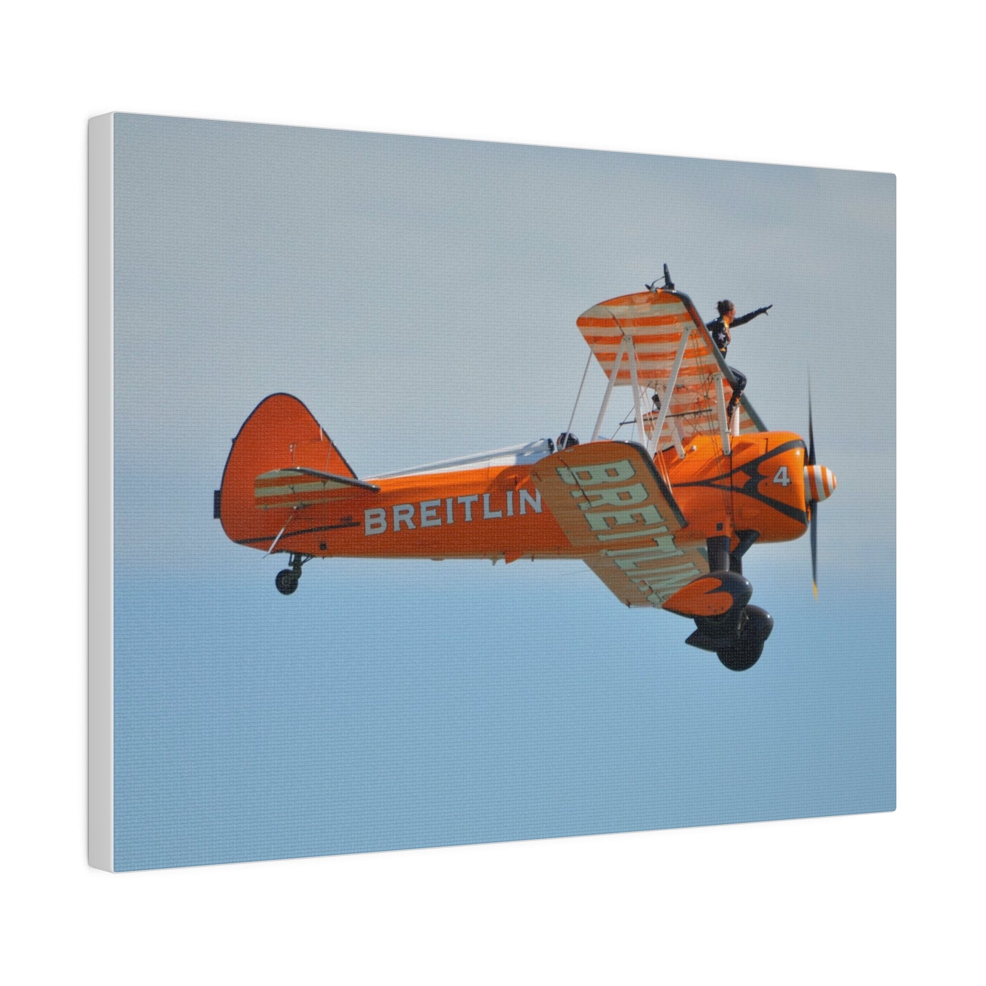 Single Wing Walker Flying From The Left Side View, With The Person Sitting On The Wing Reaching Out, Very Close Up, Matte Canvas, Stretched, 0.75" - The Trio Synergize Group