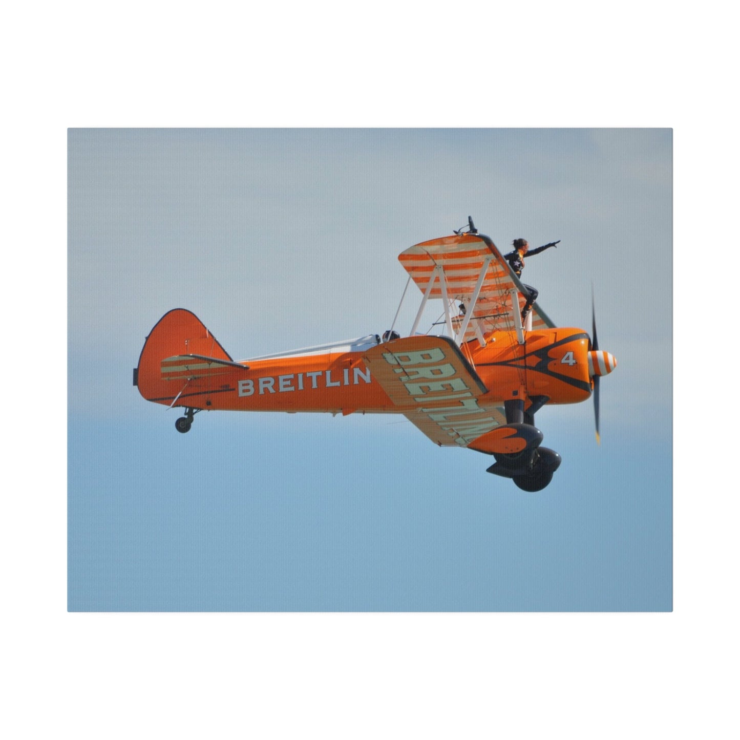 Single Wing Walker Flying From The Left Side View, With The Person Sitting On The Wing Reaching Out, Very Close Up, Matte Canvas, Stretched, 0.75" - The Trio Synergize Group