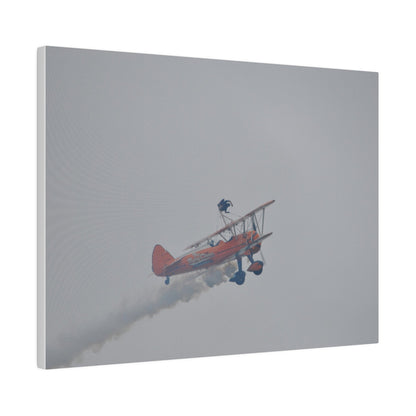 Single Wing Walker Flying From The Left With Side View Ascending, With Smoke And Person Laying Sideways Close Up, Matte Canvas, Stretched, 0.75" - The Trio Synergize Group