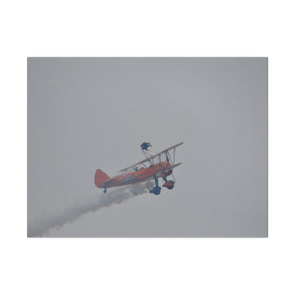 Single Wing Walker Flying From The Left With Side View Ascending, With Smoke And Person Laying Sideways Close Up, Matte Canvas, Stretched, 0.75" - The Trio Synergize Group